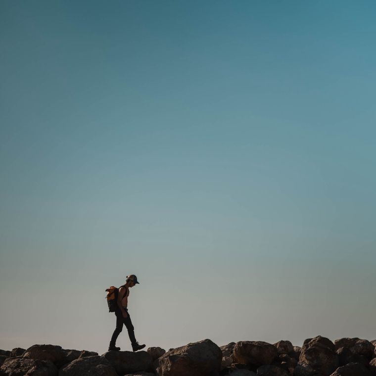A walker against the sky
