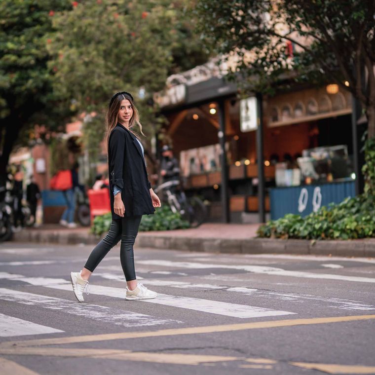 Crossing the street in the afternoon